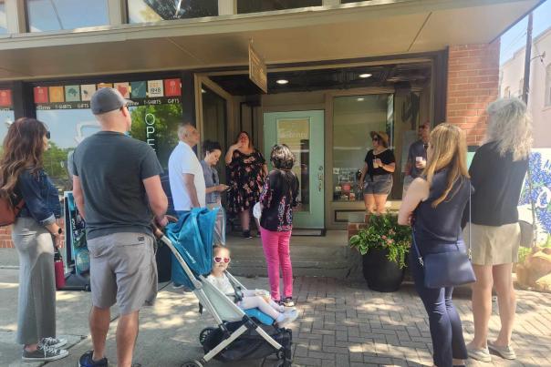 History walking tour group in front of Visit McKinney visitors center