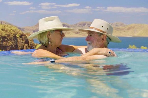two people swimming in a pool Top 10 spots for romance in the Magic Kimberley
