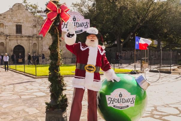 Santa standing in front of the Alamo
