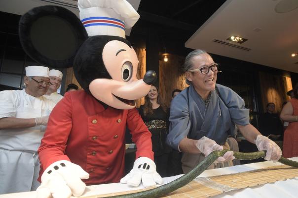 Chef Masaharu Morimoto and Mickey Mouse at the Grand Opening of Morimoto Asia restaurant in Disney Springs