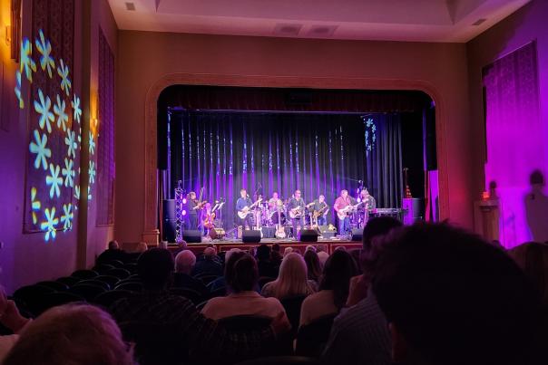 The audience enjoys a live performance at the Martinsville Entertainment Theatre by the Woomblies Rock Orchestra.