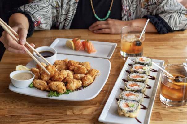 Kabuki Huntington Beach Sushi plate and Chicken Plate with person in the background