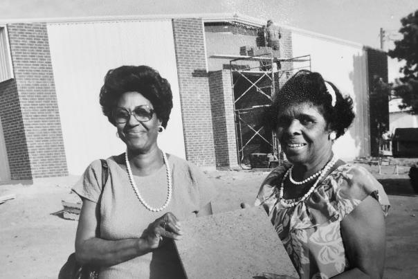Marvel White and Bertha Miller (african american community leaders) holding a brick the Amarillo United Citizens Forum sold to help fund Black Historical Cultural Center