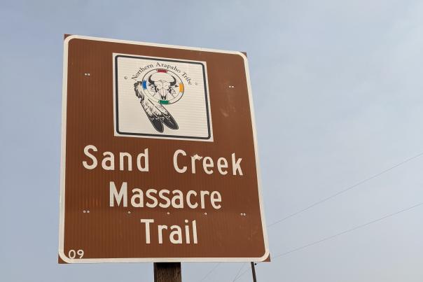 A road sign indicating the Sand Creek Massacre Trail outside of Cheyenne, Wyoming.