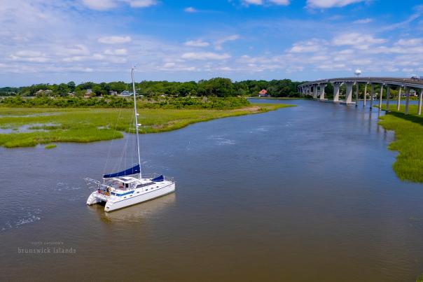 A catamaran traveling in the waterways off of Sunset Beach
