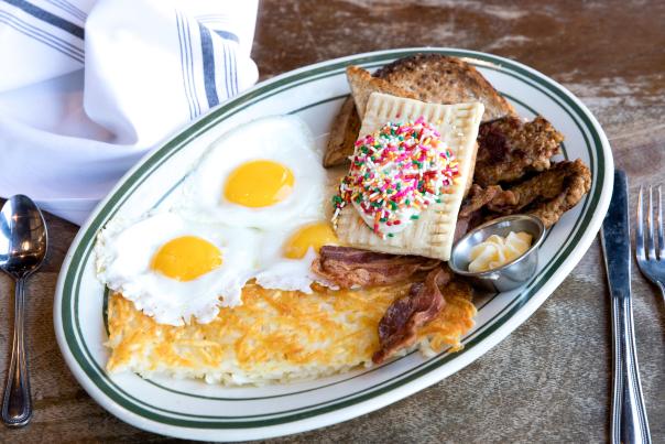 Ted's Bulletin breakfast spread featuring fried eggs, hash browns, bacon and homemade pop tarts