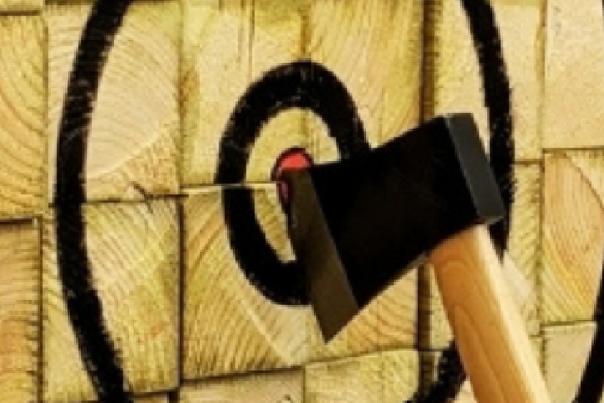 An axe which is place firmly in the centre of a bullseye