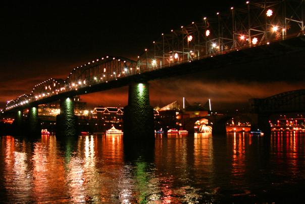 The walnut street bridge and riverfront are lit up for the holidays