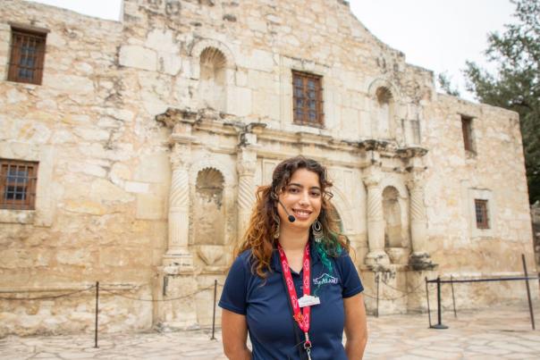 alamo employee in front of alamo