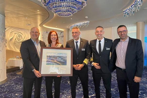 Port Everglades CEO and Port Director Jonathan Daniels presents a framed photograph to Celebrity Cruises' president and co-captains.