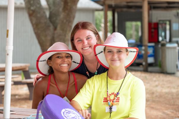 Three members of Parks staff smiling