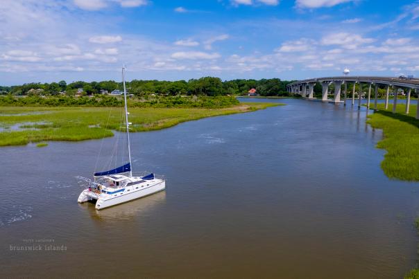 A catamaran traveling in the waterways off of Sunset Beach