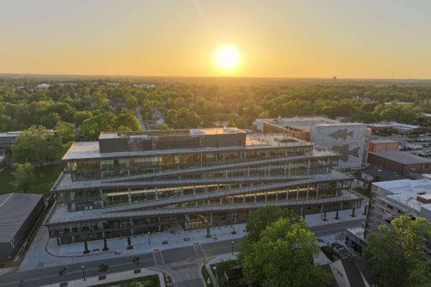 An aerial view of Ledger with the sun setting in the distance.