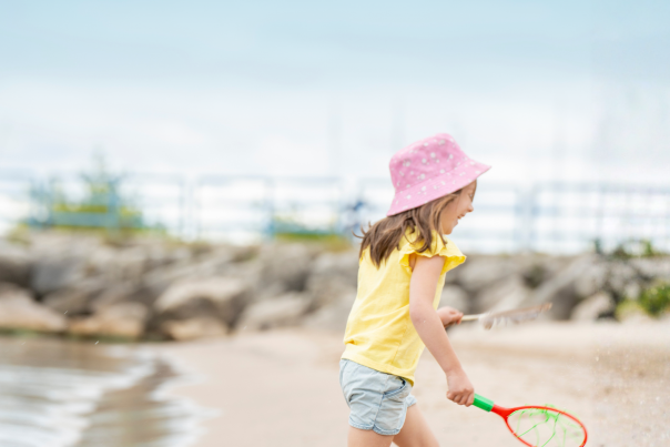 Girl Playing at Lighthouse Park Beach in Manitowoc