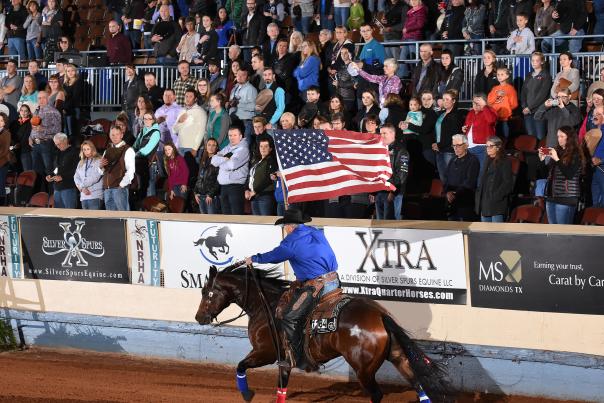 Man in Cowboy Hat With American Flag On Horse At The NRHA Derby In OKC