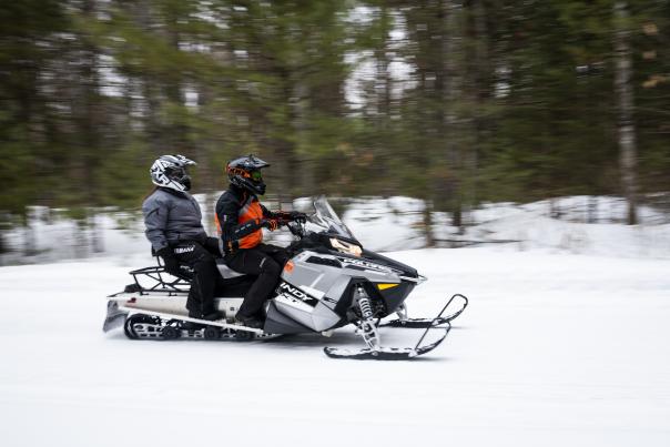 snowmobiling couple