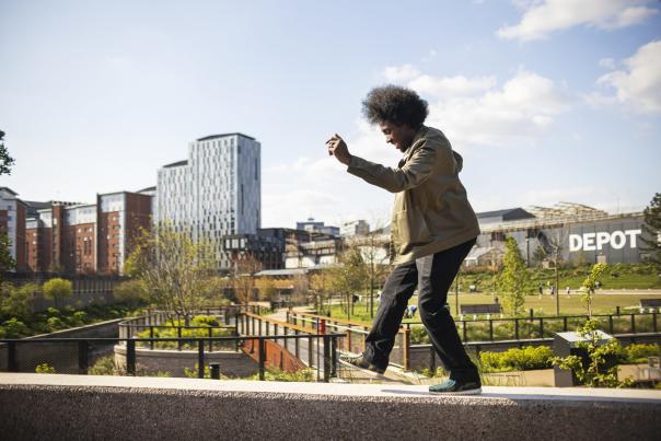 Person dancing outside of Depot Mayfield