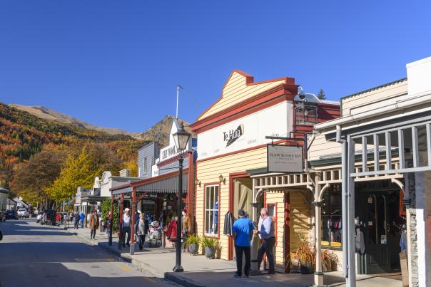 Shoppers walking along Buckingham Street, Arrowtown in Autumn
