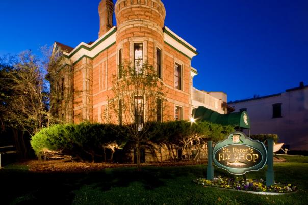 The front of an 1800's home that houses St. Peter's Fly Shop