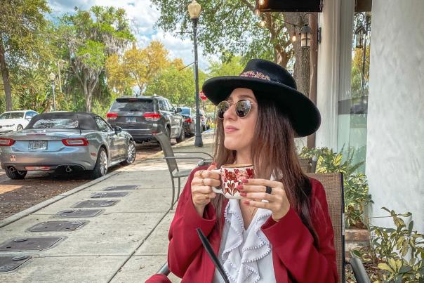 2021 Influencer Nakiesa Faraji-Tajrishi eating at CFS Coffee Shop in Winter Park