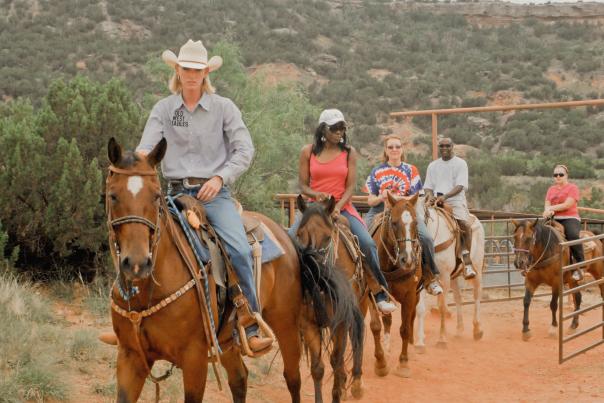People riding horses in Palo Duro Canyon