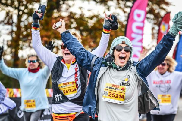 Participants crossing the finish line at Bay Bridge Run