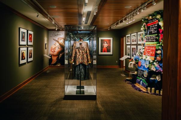 A view of the exhibit room for The Selena Effect at The Wittliff Collections at Texas State University. The exhibit includes garments, photos, momentos, and more.