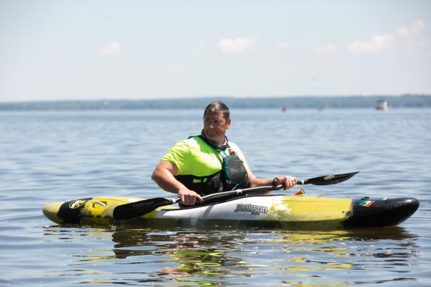 Man Kayaking on the calmer water