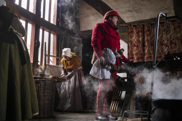 People in period costume take part in Candlemas evening at the Weald and Downland Living museum