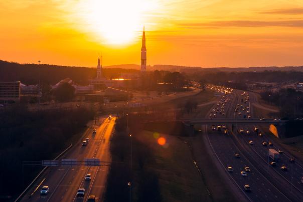 A view of the rocket from the U.S. Space & Rocket Center with a view of cars driving down the interstate