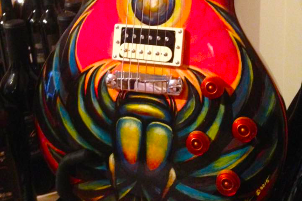 Colorfully decorated guitar found in Johnston County, NC.