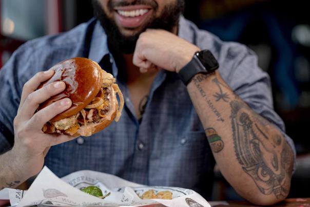 Man Eating A Burger
