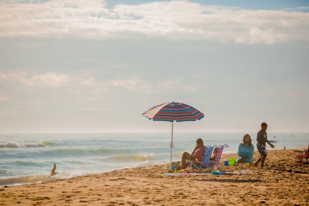 Family relaxes by the ocean in Sandbridge Beach