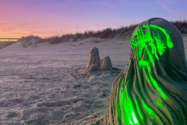 a sand sculpture with green light