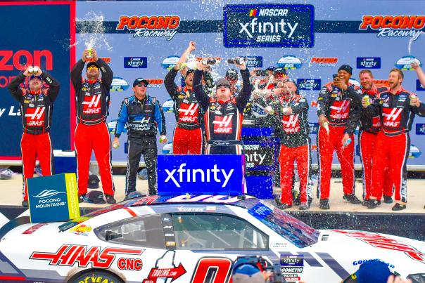 Drivers celebrate at the Winners Circle at Pocono Raceway after a NASCAR race.