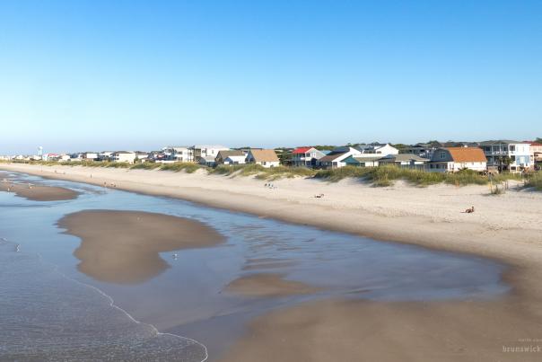 a view of a beach strand from a pier