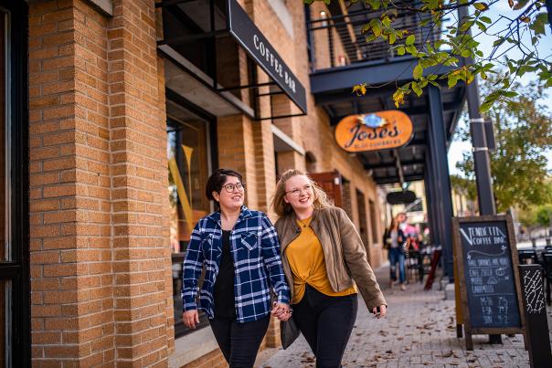 Couple happily walking Wauwatosa Street