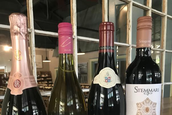 Red or White wine tasting four bottles of different wines side by side on a table
