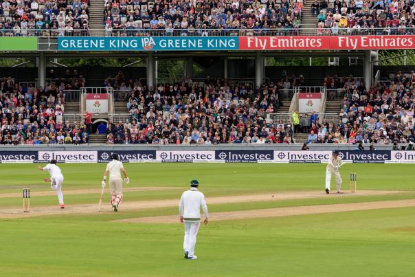 Cricket Match taking place in front of a crowd at Emirates Old Trafford