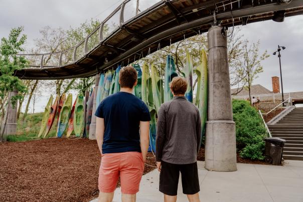 Teen boys browsing kayaks at Promenade Park in Fort Wayne