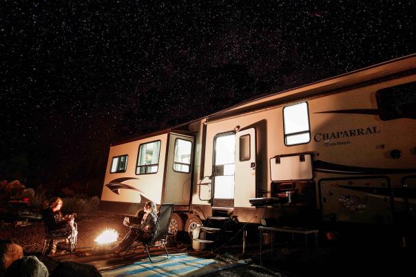 Friends enjoying starry night while RV camping