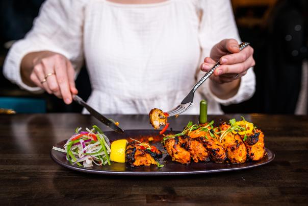 person eating indian food