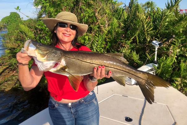 Fishing: Woman holding a nice trophy snook