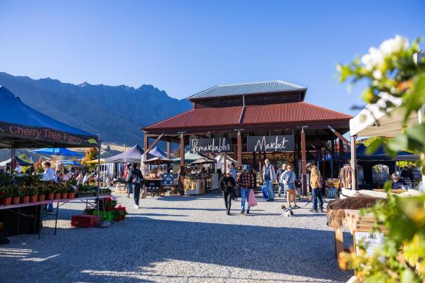 A landscape shot of the iconic Remarkables Market Red Barn on a Saturday morning