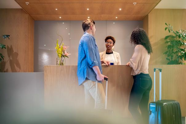 Couple checking into a hotel