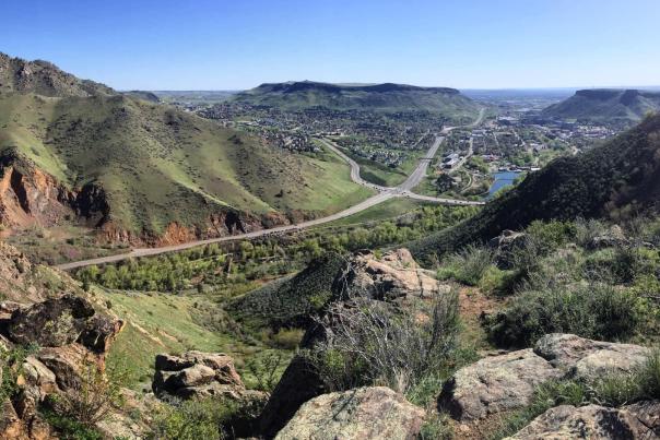 Aerial view of Golden CO and Highway 6 from Mount Zion by Lookout Mountain showing a scenic view of the mountains and mesas with the town far below.