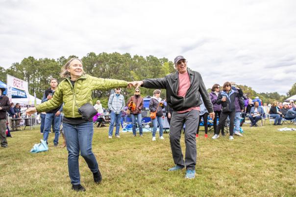 Spring into Action in your Charleston County Parks! A group of people having a great time dancing at the Lowcountry Cajun Festival.