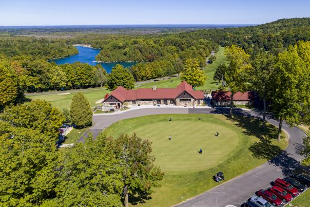 Aerial of Yards Grill with putting green in front and Green Lakes in the distance
