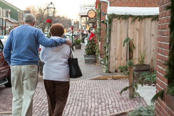 Couple walking holiday decorated Main Street in St Charles