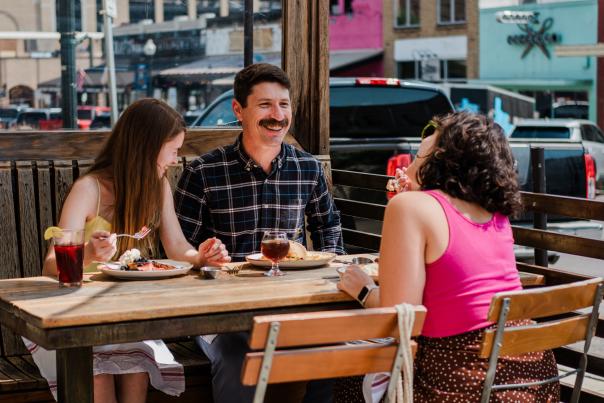 A family of three enjoy a nice leisurely brunch at Root Cellar Cafe in Downtown San Marcos